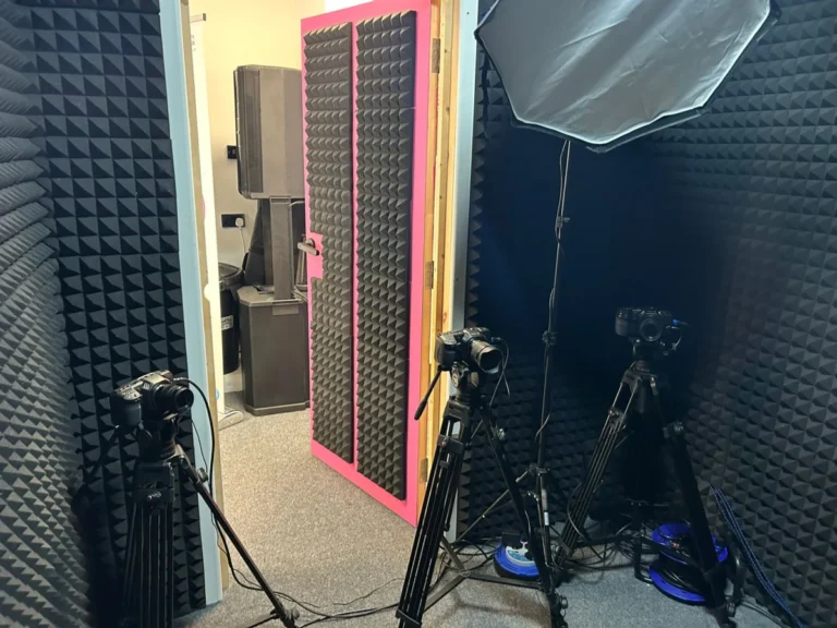 Podcast studio with acoustic panelling, cameras and lighting